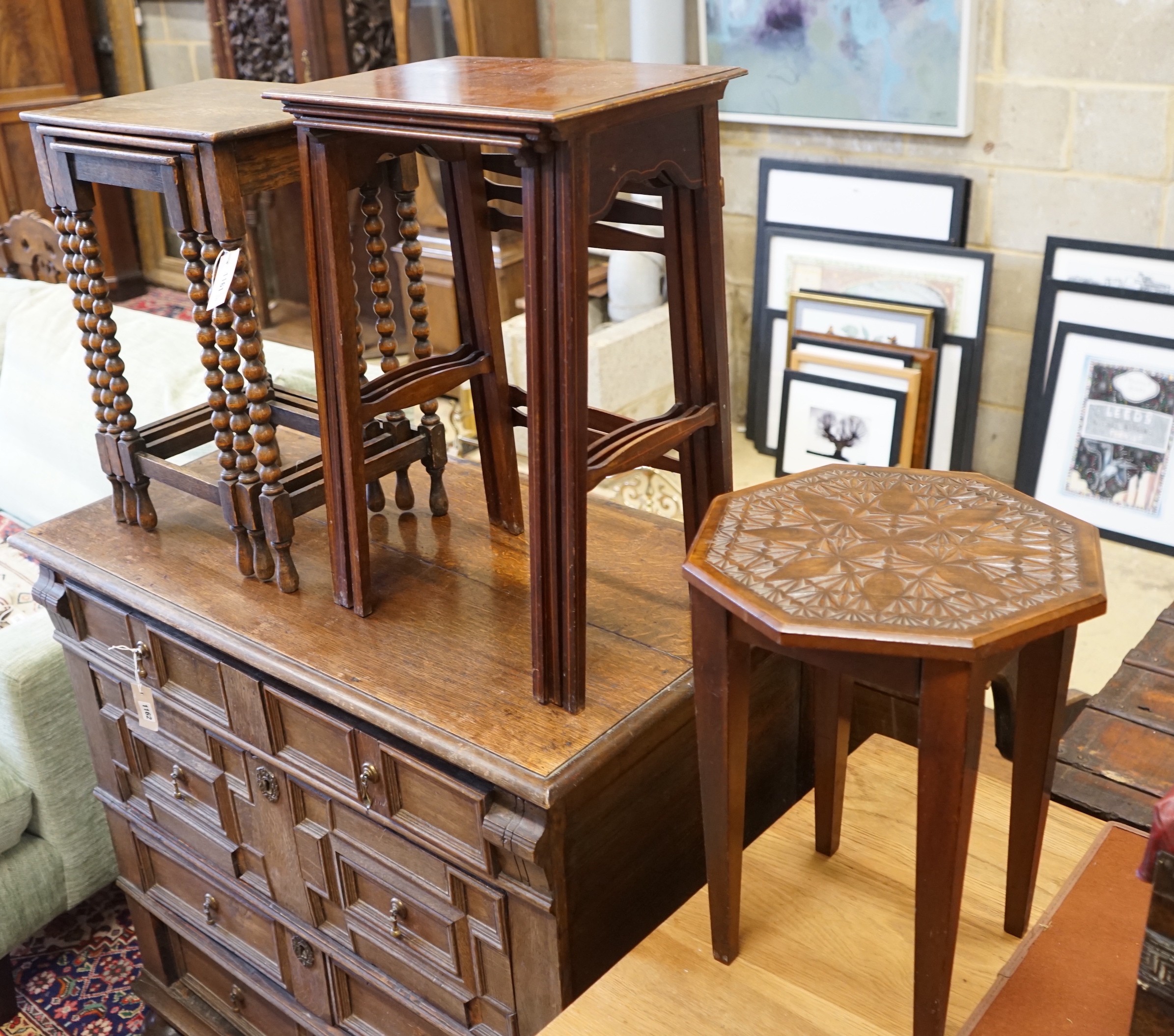 A nest of three Edwardian mahogany tea tables, height 61cm, a nest of three oak tea tables and an octagonal carved occasional table